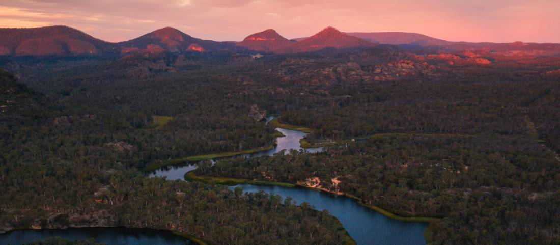 Admire the pink morning sky above Wollemi National Park