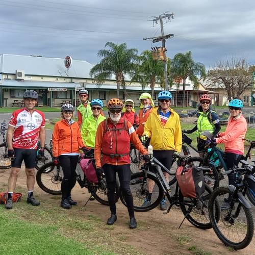 Happy group of cyclists on the Warrumbungles & Pilliga Supported Cycle tour