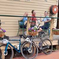 A happy group of cyclists enjoying the local cuisine. | Shawn Flannery