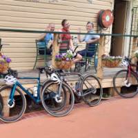 A happy group of cyclists enjoying the local cuisine. | Shawn Flannery