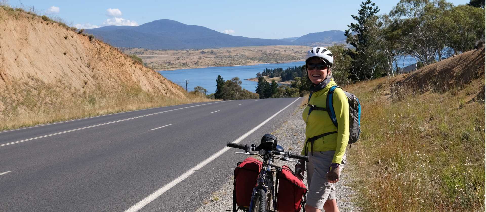 Cyclist on the Barry Way with view of Lake Jindabyne | Ross Baker