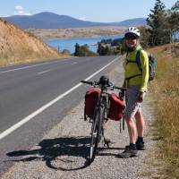 Cyclist on the Barry Way with view of Lake Jindabyne | Ross Baker