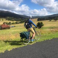 Cyclist taking in the beautiful rural scenes on Myrtle Mountain Road | Kate Baker