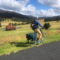 Cyclist taking in the beautiful rural scenes on Myrtle Mountain Road | Kate Baker