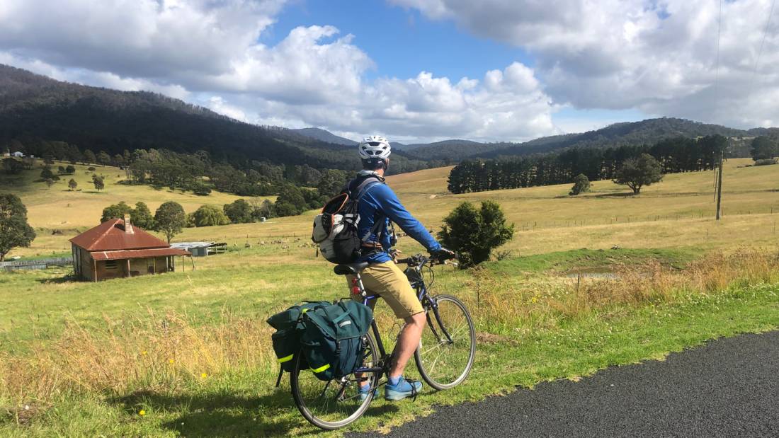 Cyclist taking in the beautiful rural scenes on Myrtle Mountain Road |  <i>Kate Baker</i>