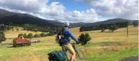 Cyclist taking in the beautiful rural scenes on Myrtle Mountain Road | Kate Baker