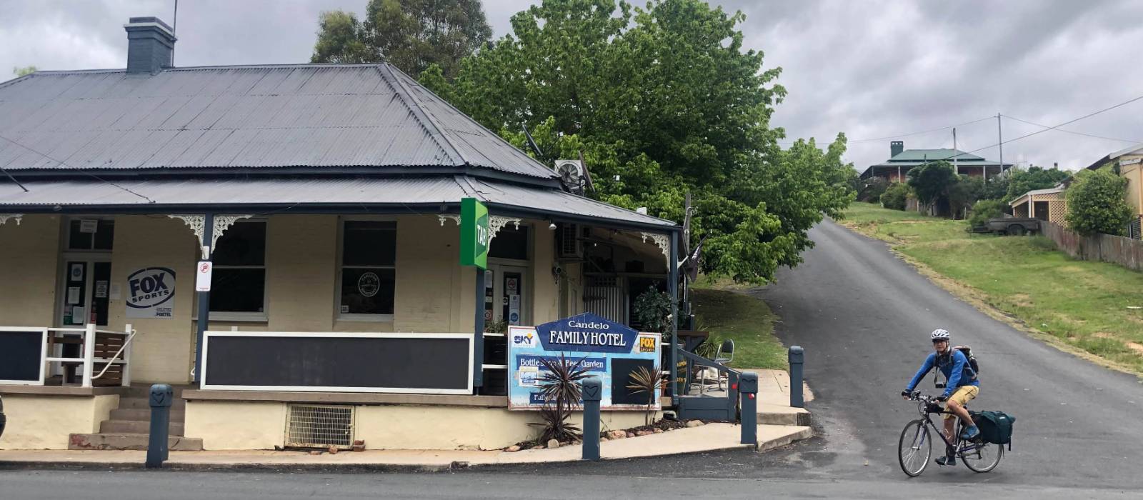 Cyclist leaving the Candelo Pub | Kate Baker