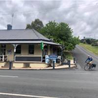 Cyclist leaving the Candelo Pub | Kate Baker