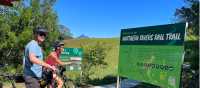 Couple on rail trail viewing Wollumbin | Kate Baker
