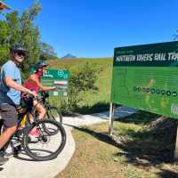 Couple on rail trail viewing Wollumbin | Kate Baker
