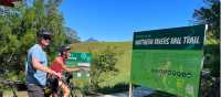 Couple on rail trail viewing Wollumbin | Kate Baker