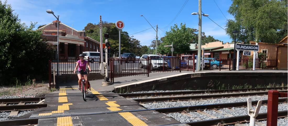 Cyclist crossing the railway lines at Bundanoon |  <i>Kate Baker</i>