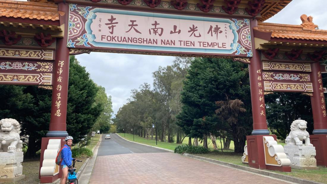 Cyclist entering the Nan Tien Temple Complex |  <i>Kate Baker</i>