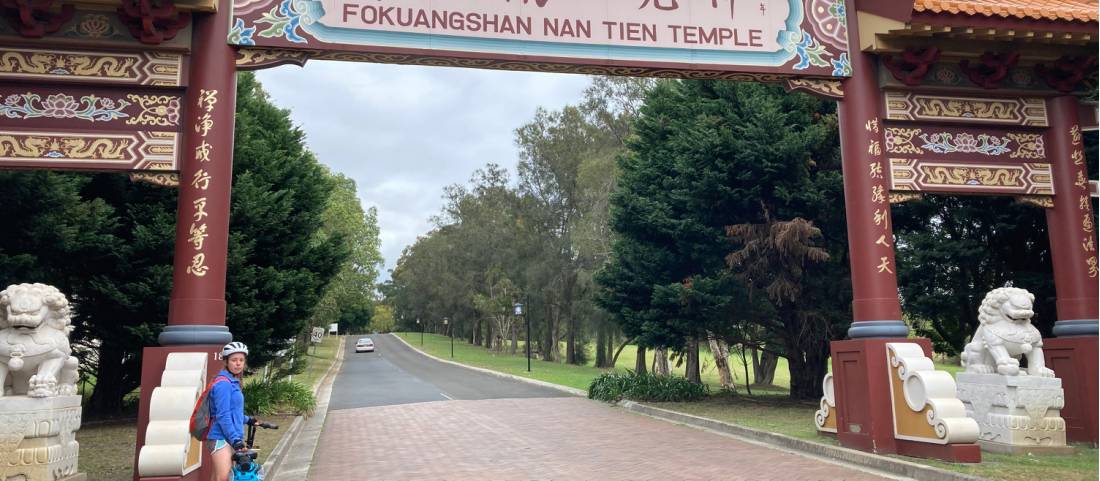 Cyclist entering the Nan Tien Temple Complex |  <i>Kate Baker</i>