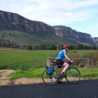 Cyclist passing the impressive escarpment of the Capertee Valley | Ross Baker