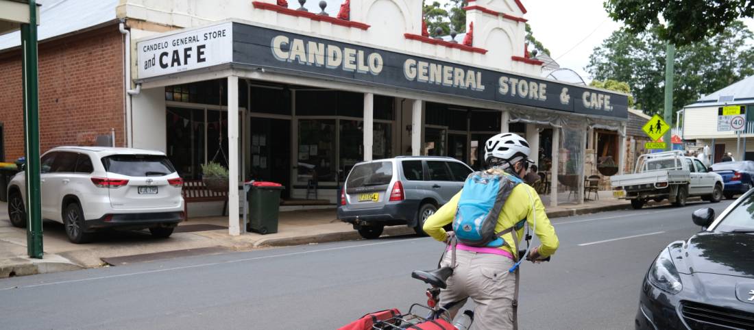 Cyclist stopping at the general store in Candelo | <i>Ross Baker</i>