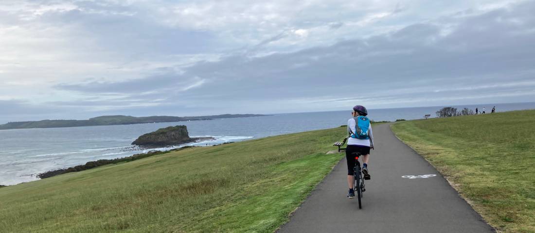 Cyclist taking in the views on the route to Kiama |  <i>Kate Baker</i>