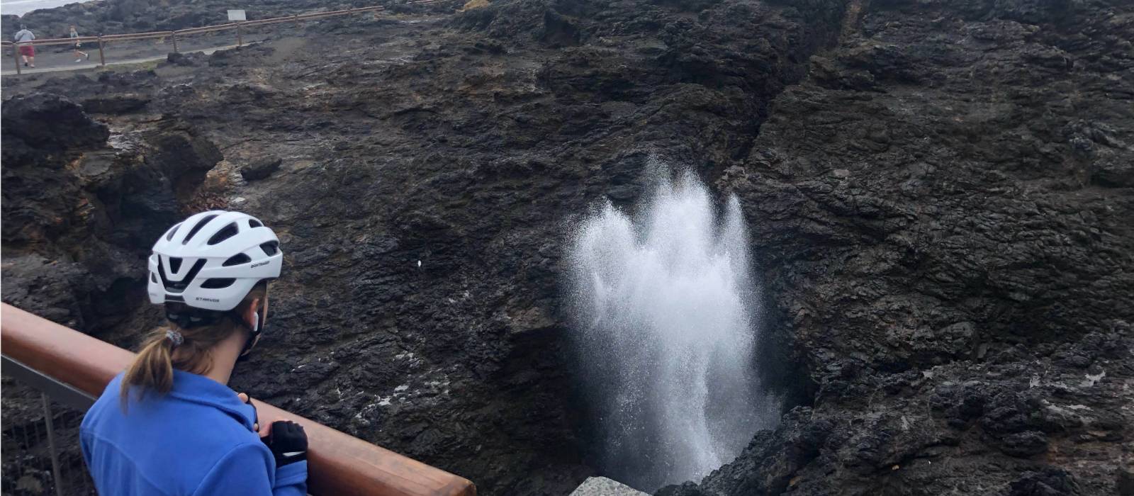 Cyclist viewing the Kiama Blowhole on the south coast cycle | Kate Baker