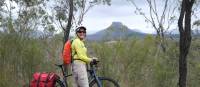 Cyclist viewing the impressive rock formations of the Capertee Valley | Ross Baker