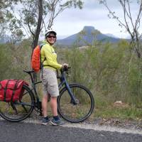 Cyclist viewing the impressive rock formations of the Capertee Valley | Ross Baker