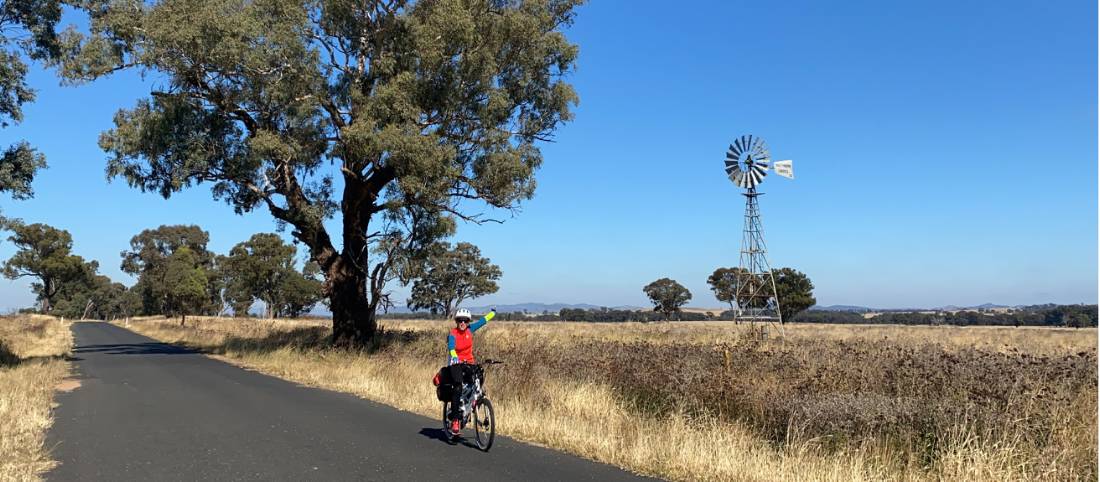 Cyclist with Windmill on route between Gulgong and Dunedoo |  <i>Michele Eckersley</i>