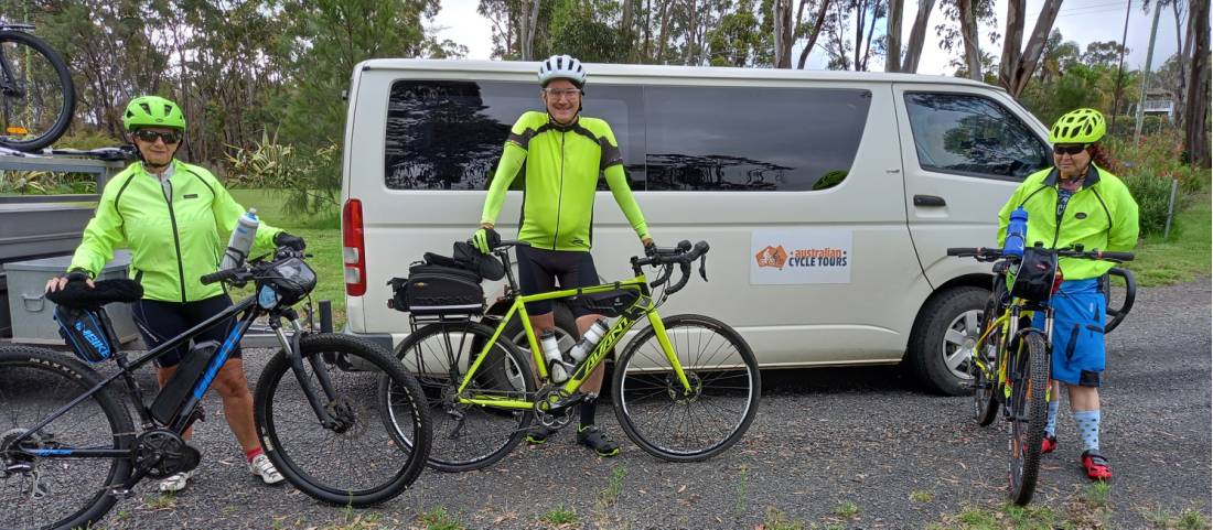 Cyclists posing with their bikes on a supported cycle tour. |  <i>Shawn Flannery</i>