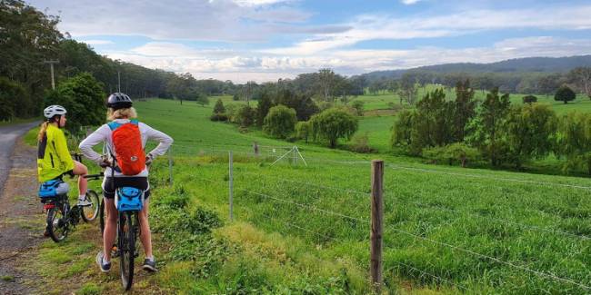 Cyclists taking in the rural vistas on the South Coast Self Guided Cycle