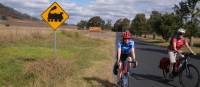 Cyclists with train signage enroute to Mudgee | Ross Baker