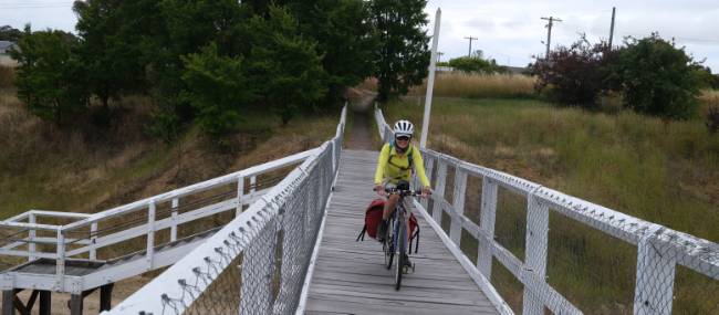 cyclist on the old railway bridge in Bombala | <i>Ross Baker</i>
