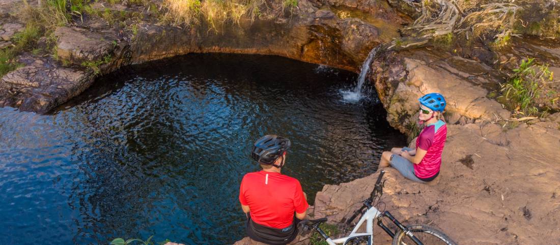 Cycling rest stop by a waterfall in the Top End. |  <i>Travis Deane</i>