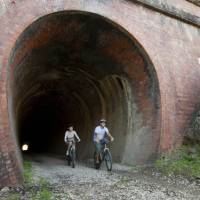 Cycling through the Cheviote Tunnel on the Great Victorian Rail Trail | Robert Blackburn