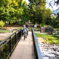 Cycling over the Ovens River bridge near Bright | Ride High Country