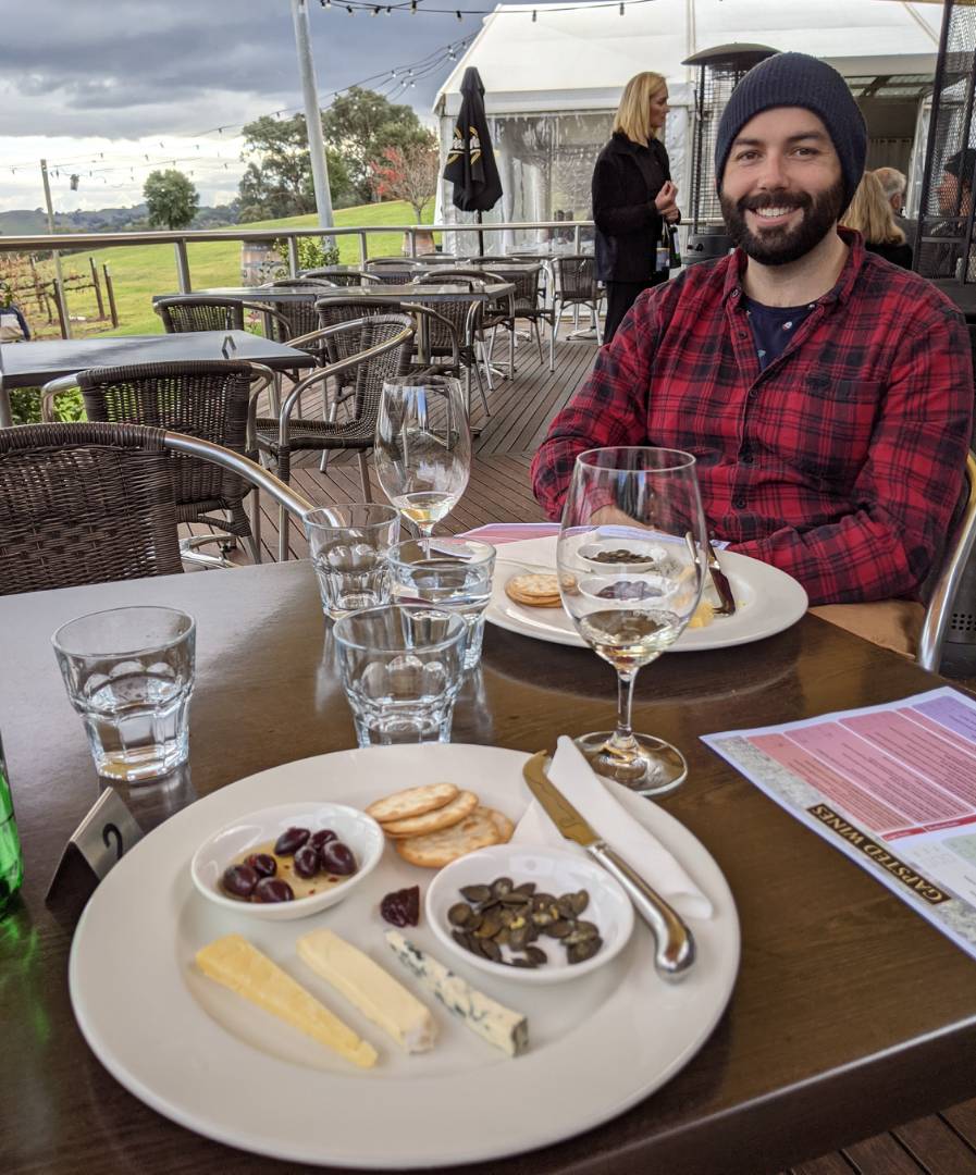 A cyclist enjoying a wine tasting while cycling on the Murray to Mountains Rail Trail |  <i>Erin Williams</i>