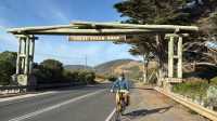 Cyclist at the iconic Great Ocean Road sign |  Kate Baker