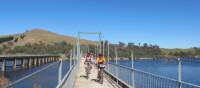 Cyclists on the Bonnie Doon Bridge over Lake Eildon | Rail Trails Australia