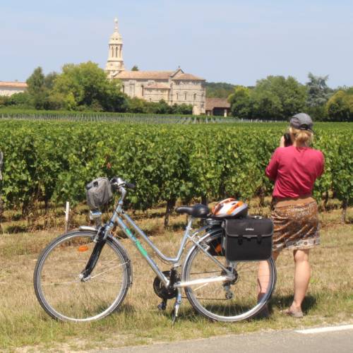 Cyclist stopping to take a photo in Bordeaux