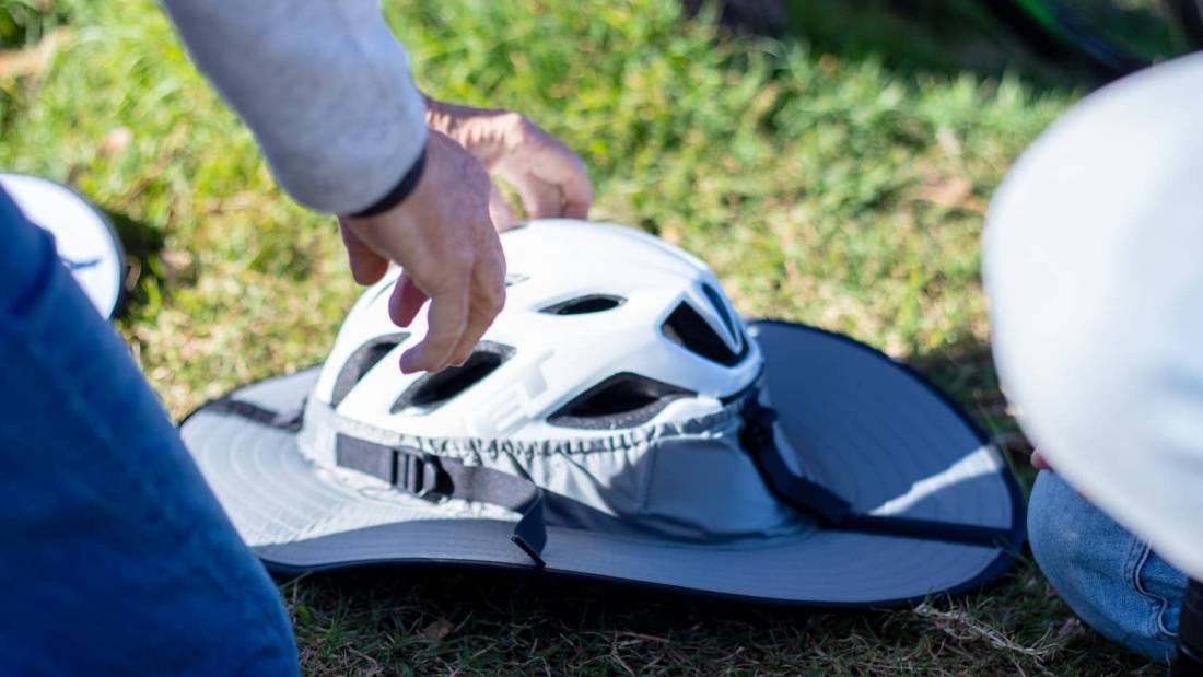 The broad visor can attach to any helmet