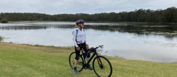 Cyclist taking in the view on the Thirroul Wollongong cycle route | Kate Baker