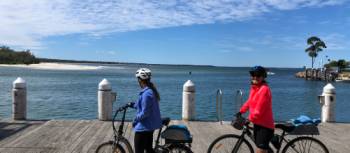 Cyclists taking in the view in Huskisson on Jervis Bay | Kate Baker