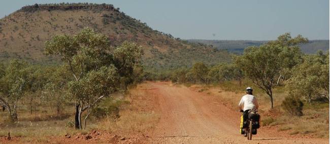 Kate cycles the Buchanan Highway on the way to Victoria River Downs Station | Kate Leeming