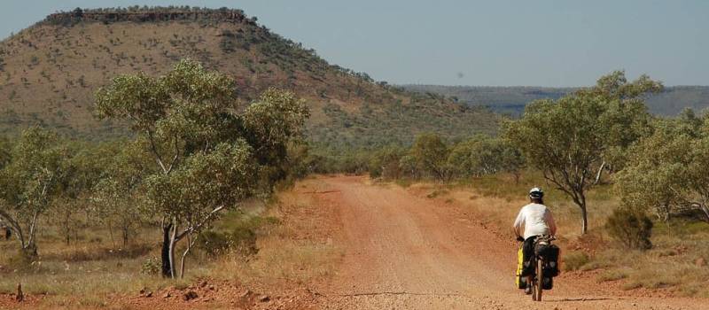 Kate cycles the Buchanan Highway on the way to Victoria River Downs Station | Kate Leeming